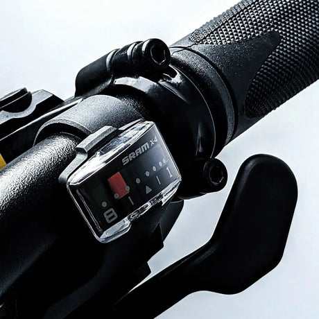 Close-up of SRAM X4 gear shifter on Thor Road-eMTB Hybrid eBike handlebar, designed for UK terrains with precision shifting performance.